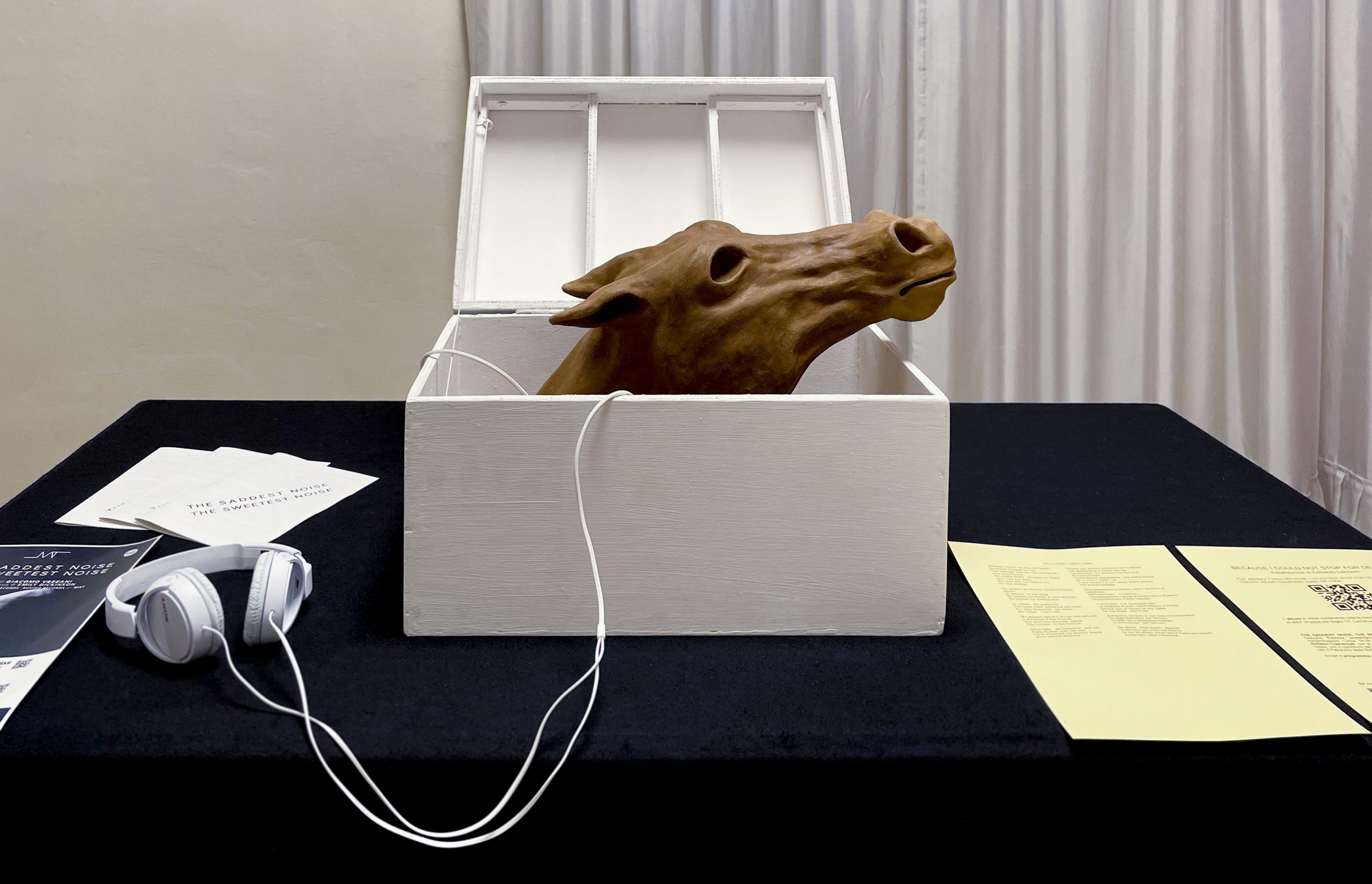 Full image of the chest containing the horse sculpture.